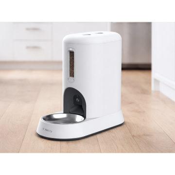 Petivity Smart Feeder for Cats on kitchen floor, white design with stainless steel bowl